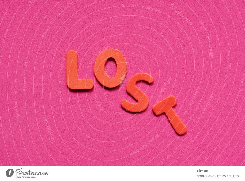 LOST is shifted in red letters on pink background lost Doomed submerged Missed vertan Fallen English get lost Blog Lose unpromising Foam rubber Loneliness