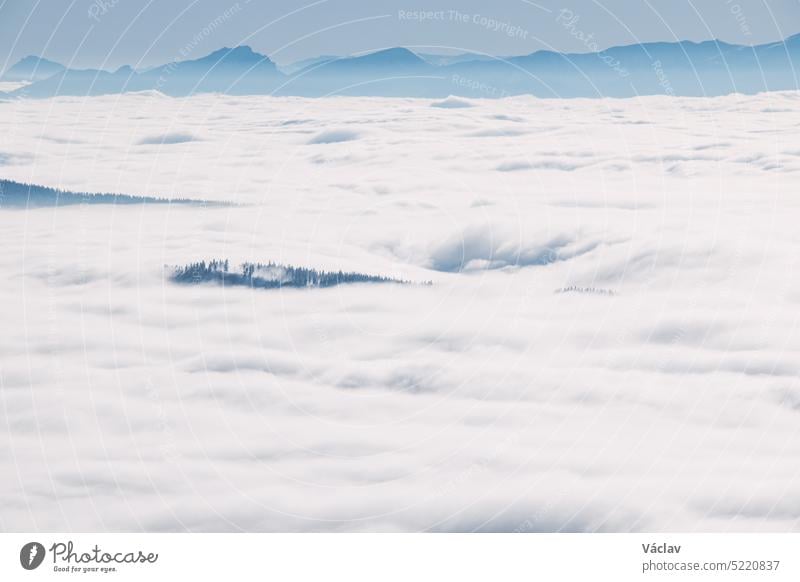 Morning clouds rolling over the scenery and mountains over the Czech Republic creating different formations based on temperature, pressure and airflow. Meteorology