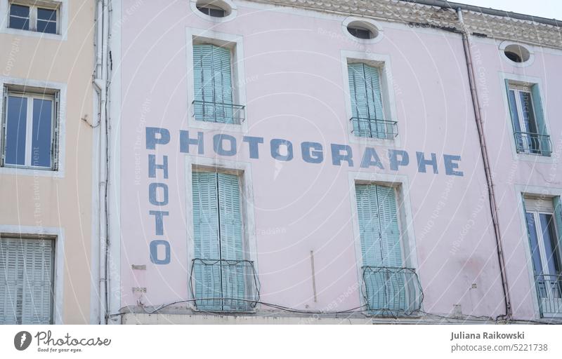 Inscription of a French photography store Store premises Photography Town Facade House (Residential Structure) Subdued colour Deserted Old Exterior shot