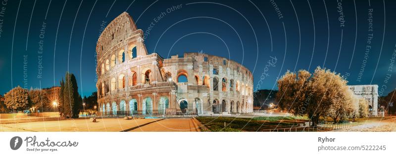 Rome, Italy. Colosseum Also Known As Flavian Amphitheatre In Evening Or Night Time. heritage italian Amphitheater copy space night travel rome monument blue