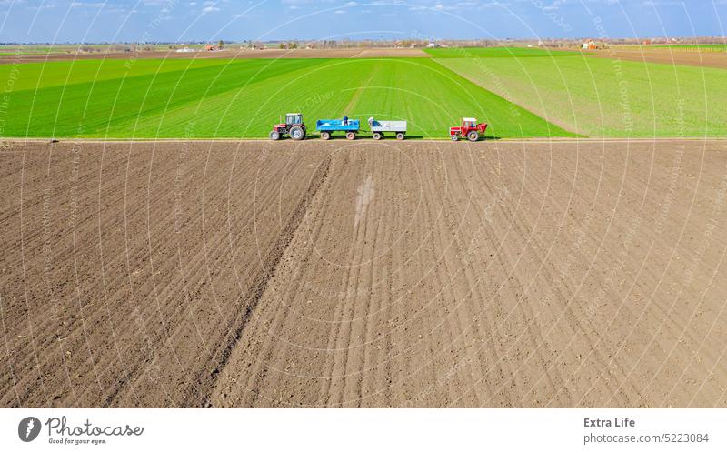 Aerial view on loading machine for spreading fertilizer Above Agriculture Arable Around Artificial Cargo Cereal Chemical Country Crop Cultivated Cultivation