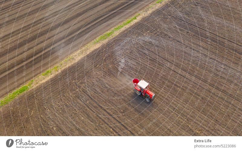 Aerial view on tractor as spread fertilizer over agricultural field Above Agricultural Agriculture Agronomy Arable Artificial Barley Care Cereal Chemical Corn
