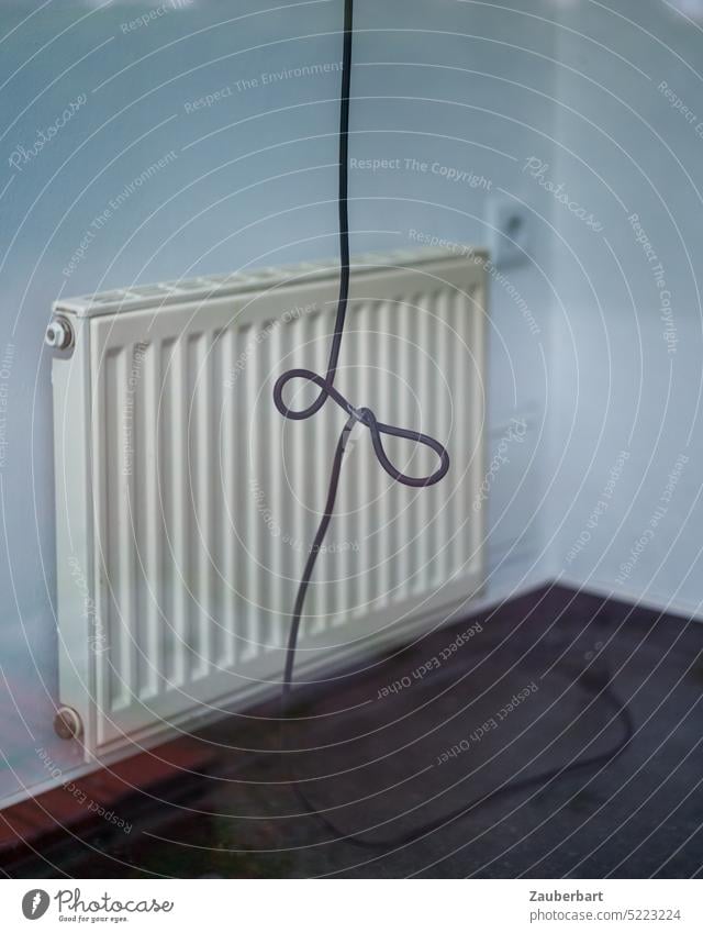 Radiator, power cable and socket as a symbol for energy crisis, heating exchange and helplessness Heater Socket Connector Energy crisis Heating Heating exchange
