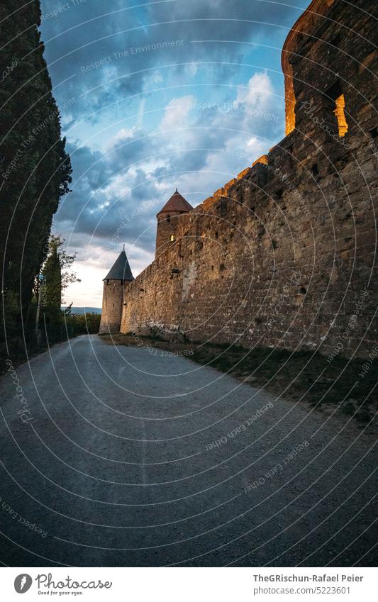 Castle in evening mood Carcassonne Lock Twilight Moody dramatic sky Perspective Exterior shot France Tourism Tourist Attraction Sky dim light Wall (barrier)