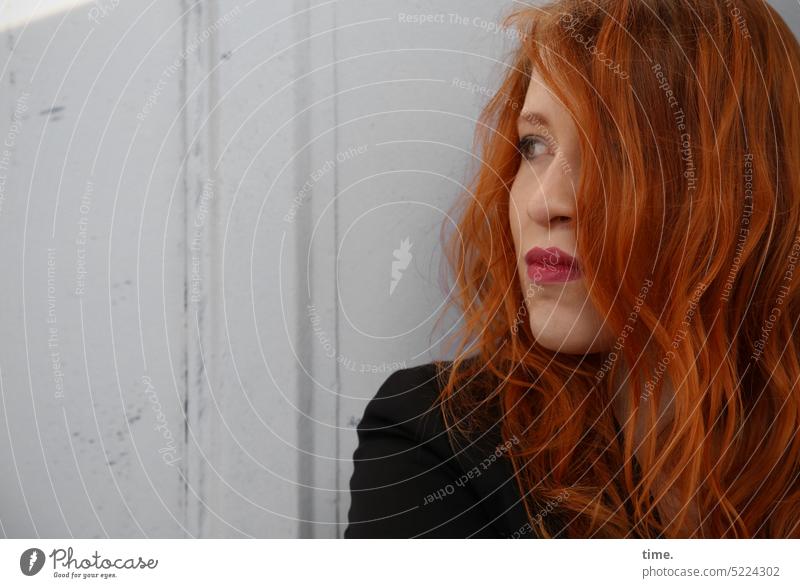 Woman with red hair in penumbra Feminine Red-haired Wall (barrier) Wall (building) Jacket Think Observe Long-haired Looking Wait pretty Conscientiously