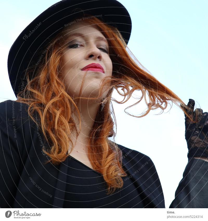 Woman with red hair, hat and gloves Feminine Sky Clouds Beautiful weather Wind T-shirt Long-haired Red-haired feminine Hat Jacket Curl Observe Think Looking