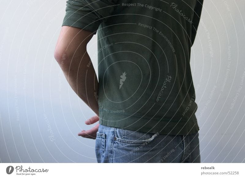 Posture Body language Gestures Design Services Career Success Masculine Man Adults Chest Arm 1 Human being Clothing T-shirt Jeans Communicate Stand Wait Green