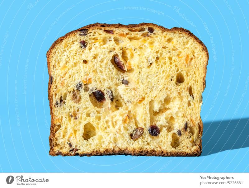 Sourdough panettone interior. Panettone sliced in half, minimalist on a blue background baked bread bright brown cake celebration christmas close-up color