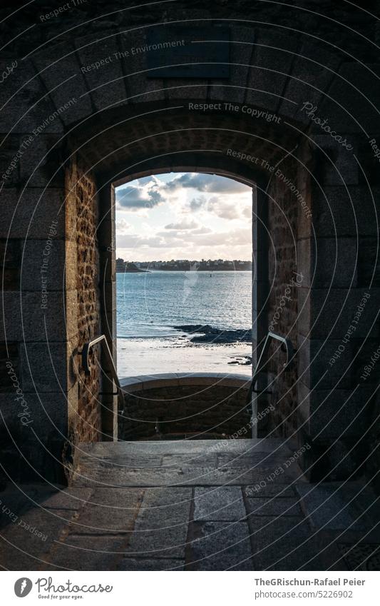 Door through wall with sea view Wall (barrier) Town France travel Tourism Brittany Vacation & Travel Landscape Exterior shot Saint-Malo Landmark Architecture