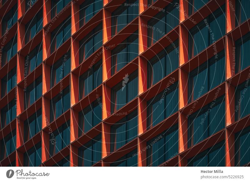 In the blue hour, with the sky and the building, in the city, urban and romantic landscape, building with orange windows Architecture architectural photography