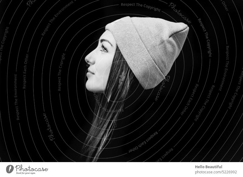 Woman with cap in black and white Cap beanie black-white Black White Model urban Looking focus devout Belief Trust long hairs feminine Profile Face Winter