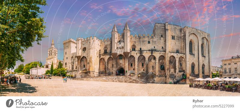 Avignon, Provence, France. Panorama of Ancient Popes Palace, Saint-Benezet, Avignon, Provence, France. Famous landmark. Altered Sunset Sky ancient architecture
