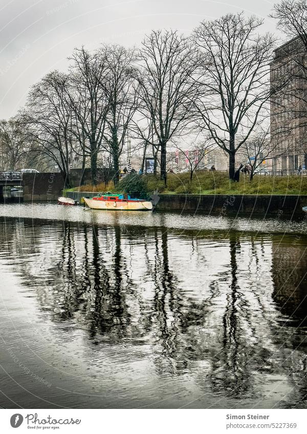 Boat on a canal in Amsterdam Channel boat River Water Netherlands Europe Reflection
