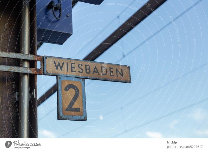 historical railroad sign direction "Wiesbaden", track 2, in Kaub am Rhein Historic Train station Track Signs and labeling Weathered two Track 2 futura