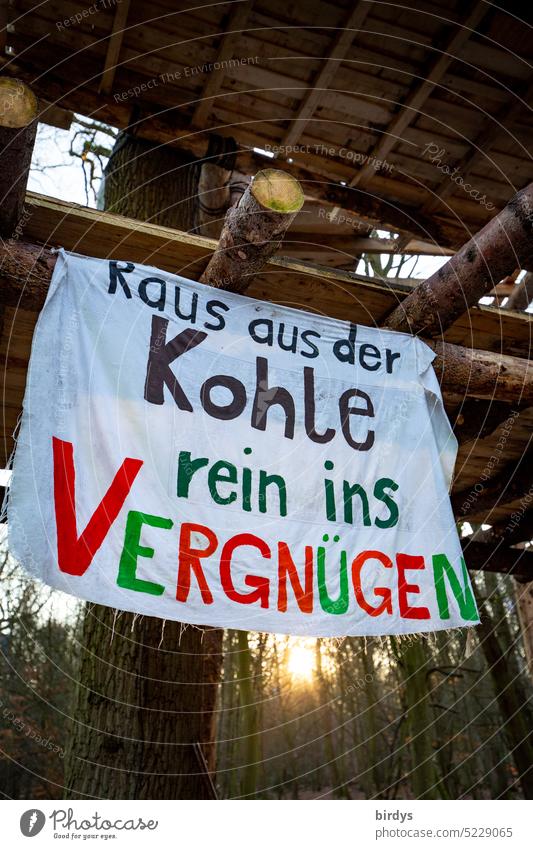 Out of the coal, into the fun. Banner on a tree house in Hambach Forest coal exit Climate protection Climate change Future Lignite Text transparent Hambi