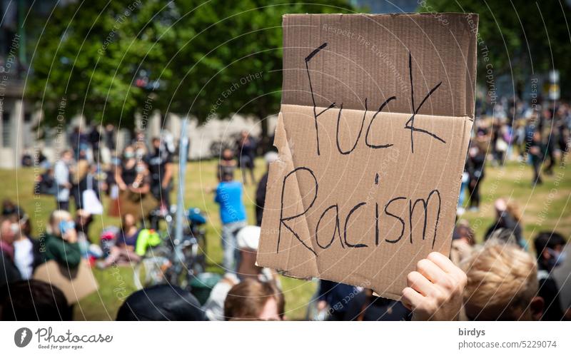 Fuck Racism. Protest sign at a demonstration against racism . Everyday Racism Fuck racism Germany Skin color equality Origins Fundamental rights Equal treatment