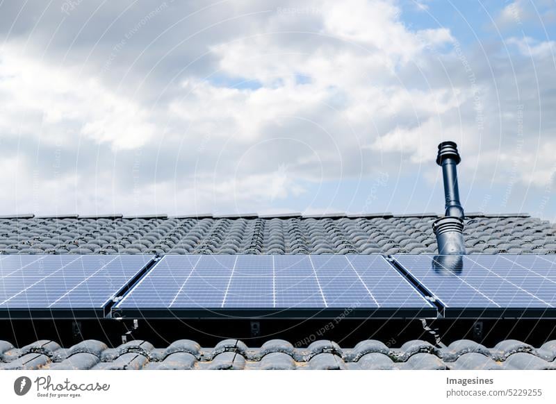 Balcony power plant. Solar panels on the roof solar collectors Roof Close-up sunny Sky stream Produce Energy efficiency Architecture backgrounds Industry Clouds