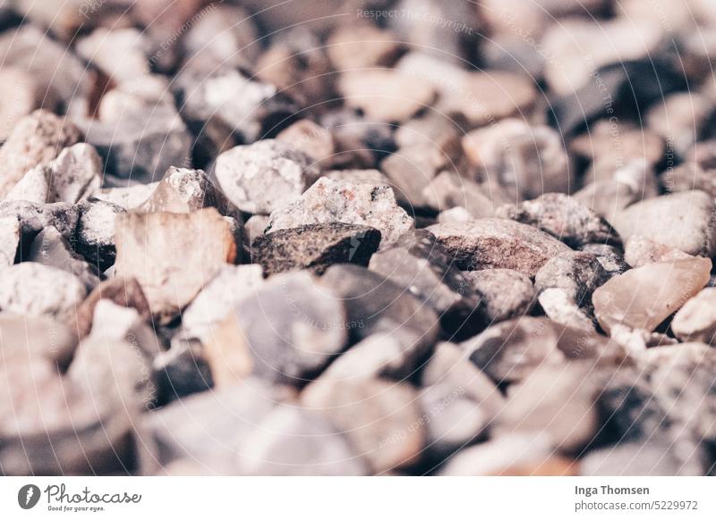 An area of pebbles. Pebble stones Gray surface Close-up Pattern