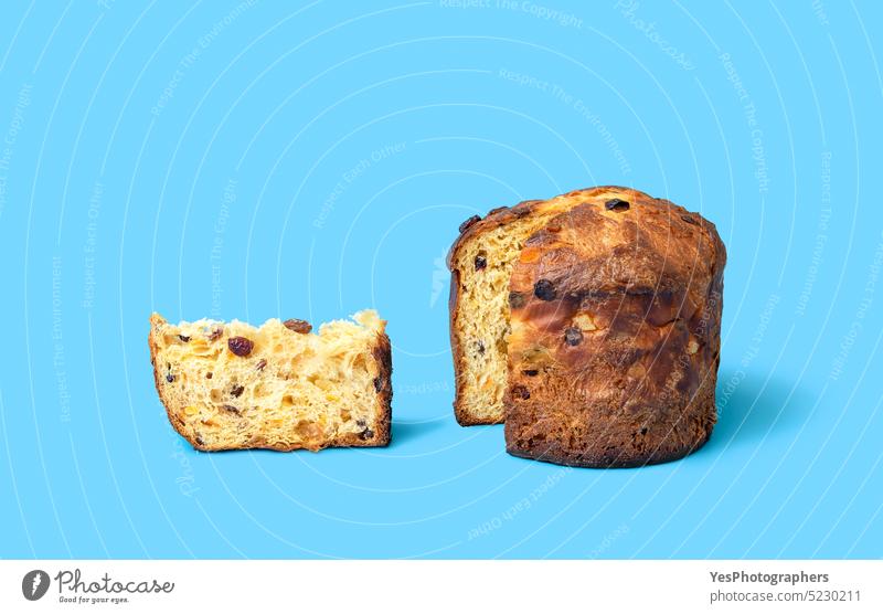 Sliced panettone on a blue background. Homemade sourdough panettone baked bread bright brown cake celebration christmas color concept copy space cuisine