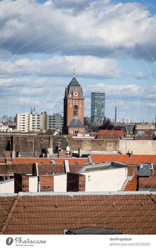 View over Neukölln with roofs and sun and new buildings and church Deserted Copy Space middle Structures and shapes Copy Space top Pattern Abstract Contrast