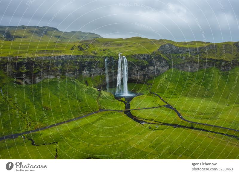 Aerial view of Seljalandsfoss - most famous best known and visited waterfalls in Iceland iceland seljalandsfoss high travel green landscape nature summer sky