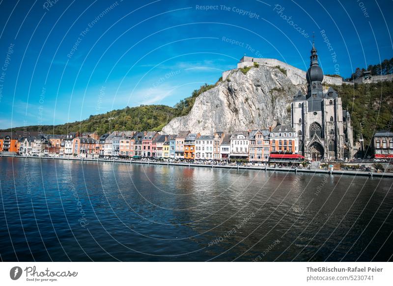 Church and building on the river in front of fortress dinant Belgium Building Architecture Fortress Rock Tourism River Forest Water River bank Town Landmark