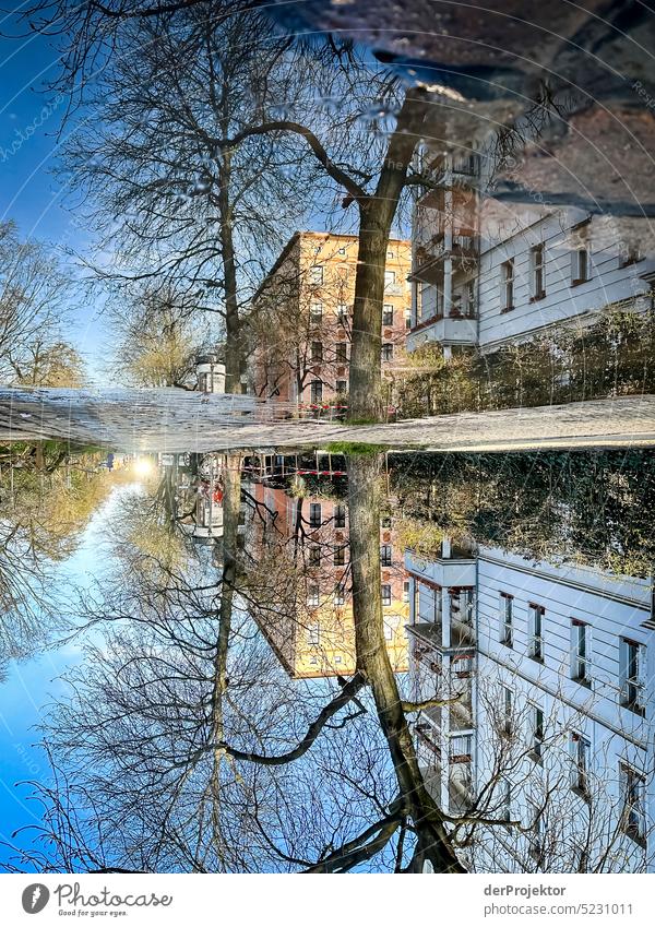 A reflection of a house in a puddle in Kreuzberg Aerial photograph Deserted Copy Space middle Structures and shapes Copy Space top Pattern Abstract Contrast