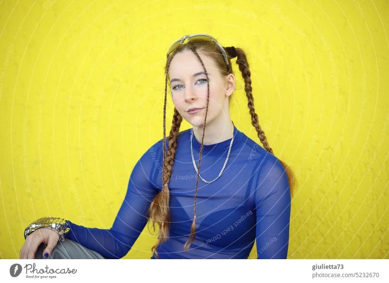 Raver girl - styled with braids in cool blue techno outfit in front of yellow wall portrait Girl Youth (Young adults) Teenage Girls teenager Exterior shot