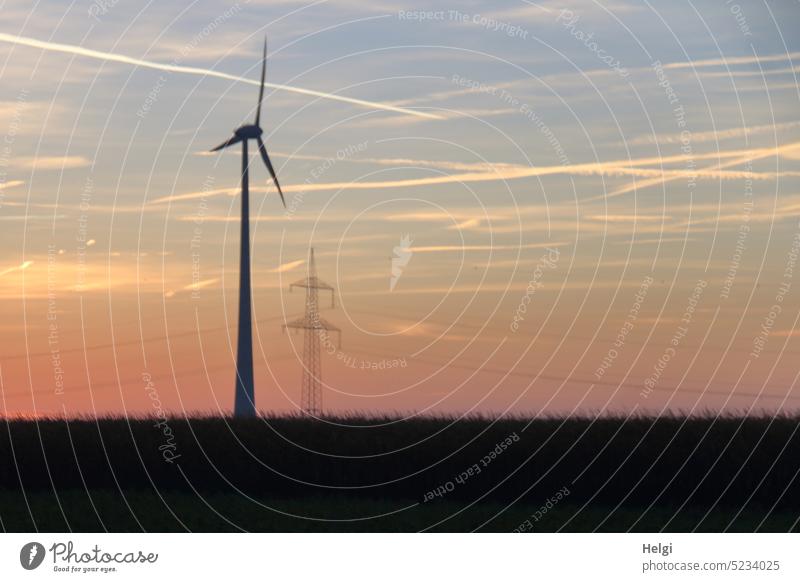 Image glitch | wind turbine and power pole at sunrise, blurred Pinwheel Wind energy plant Electricity pylon Power Generation Energy Morning Sunrise Sky Meadow