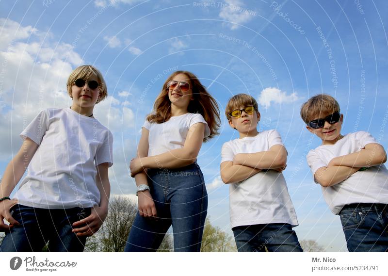 Group picture with sunglasses youth of today Brash youthful white T-shirt Jeans pose Brothers and sisters Family & Relations four Friends Together Friendship