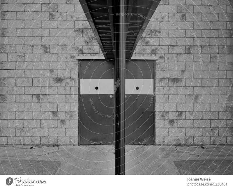 Wall and door with reflection Reflection Considerations black on white Black and white photography Building Black & white photo Deserted Old building