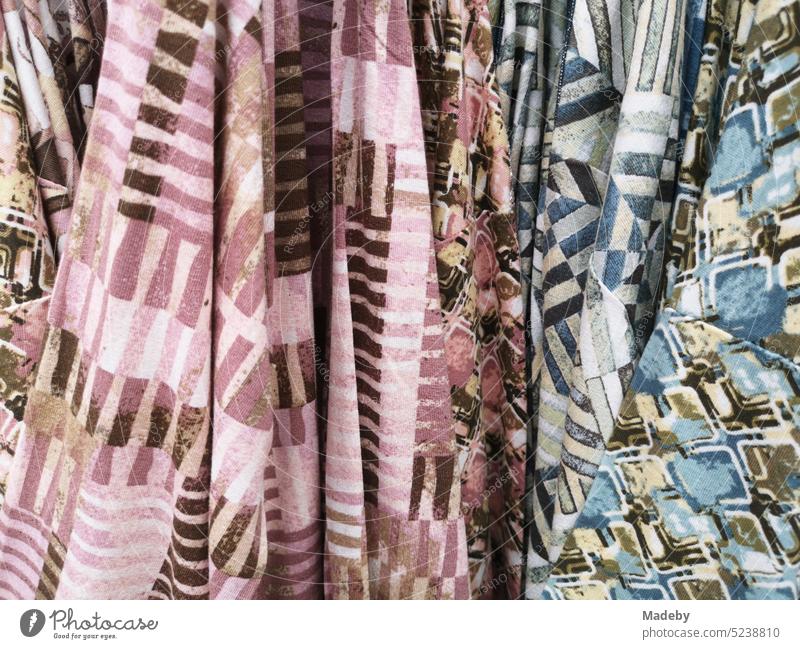 Wildly patterned scarves and fabrics for special tastes in a store in the city center of Lage near Detmold in East Westphalia-Lippe Alley Decoration SME Trade