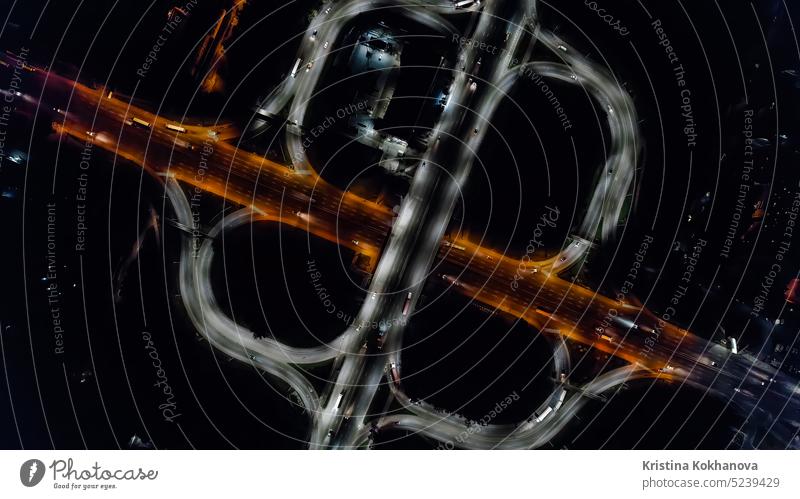 Aerial drone top view at roundabout lane, traffic on junction of night city above aerial aerial view architecture blur bridge building business car cars