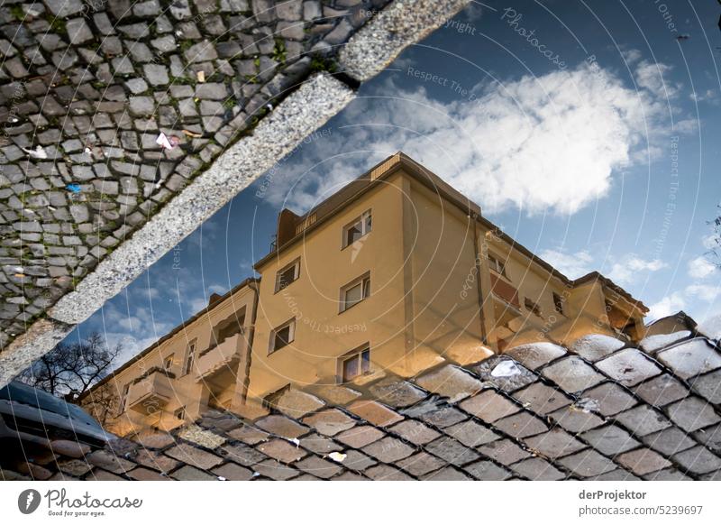 A reflection of a house in a puddle in Neukölln Aerial photograph Deserted Copy Space middle Structures and shapes Copy Space top Pattern Abstract Contrast