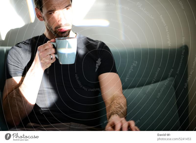 Man drinking fresh coffee in the morning Break Coffee Coffee break Sunbeam To have a coffee Drinking Stress tranquillity time-out Meditative thoughts Doubt
