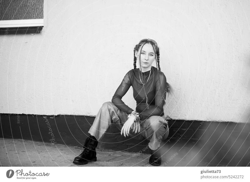 Black and white portrait of teenage girl - raver girl styled with braids in cool techno outfit Black & white photo Central perspective Youth (Young adults)