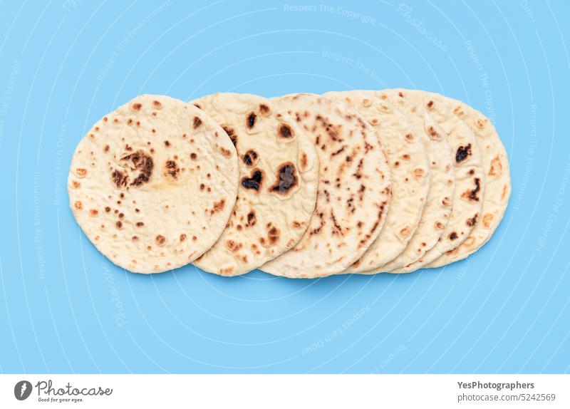 Homemade flatbread on a blue table. Top view with a pile of naan bread. above afghan arabic arranged asian background baked bakery bright classic color cuisine