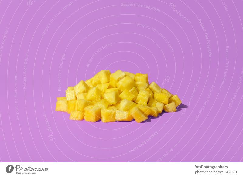 Pineapple pieces on a purple background. Pineapple juice concept ananas bright close-up color copy space cubes cuisine cut out delicious dessert diet food fresh