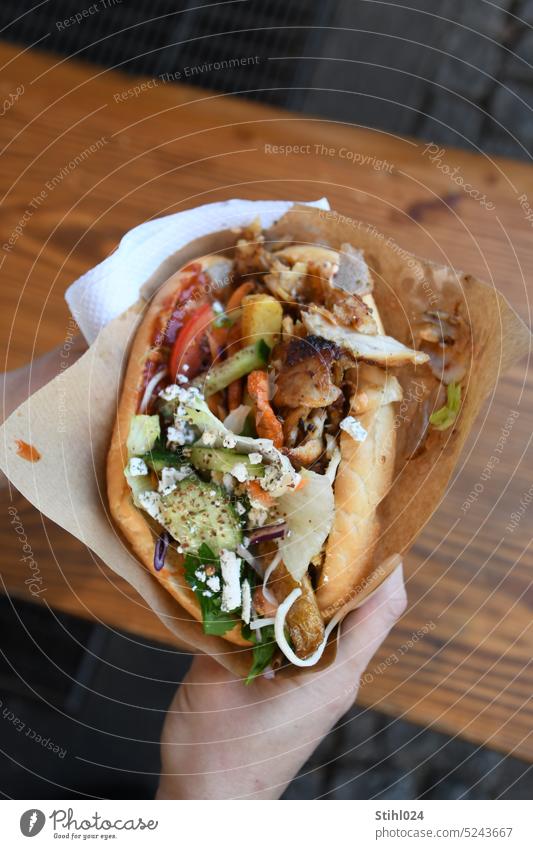 Kebab with everything - that's the name All fast food Turkish German Berlin tart Bread Flat bread pide Snack Lettuce Sandwich Delicious Lunch Tomato