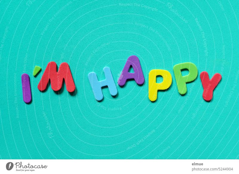 I'M HAPPY is written in different colored letters on turquoise background I'm happy cheerful contented English variegated Colour I am happy I am glad