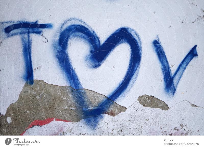 blue heart with blue letters T and V on peeling house wall /graffiti Heart Love Proof of love Infatuation Graffiti Blog Declaration of love Emotions With love