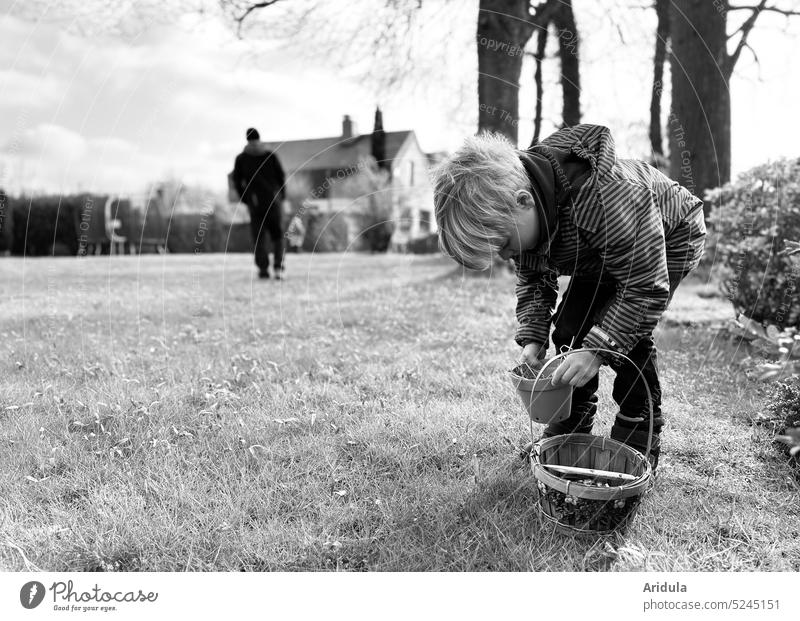 Child looking for Easter nests in garden search Garden Nature Spring Feasts & Celebrations Tradition Public Holiday Easter egg Infancy Basket Meadow Lawn Grass