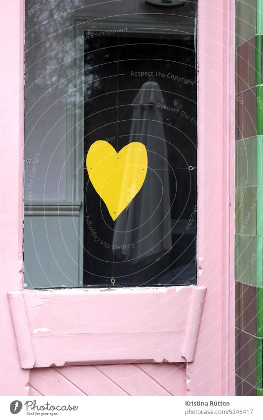 yellow paper heart to pink and green Heart symbol Sign Love Window door Yellow symbolic glass. pane Window pane reflection Sunshade trees With love In love