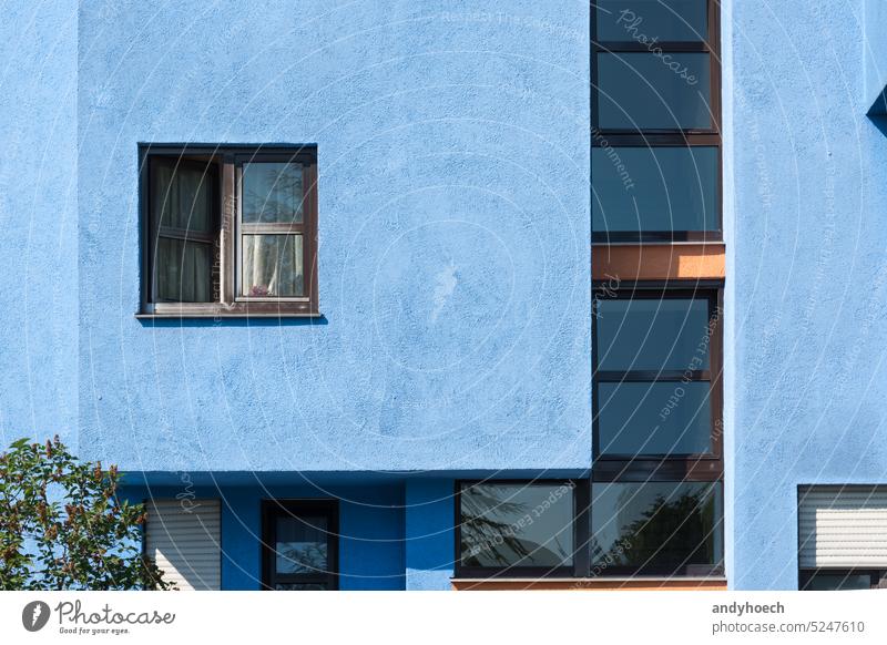 Brown window in a blue facade with beautiful geometric shapes apartment apartment building architectural architecture city comfortable construction contemporary