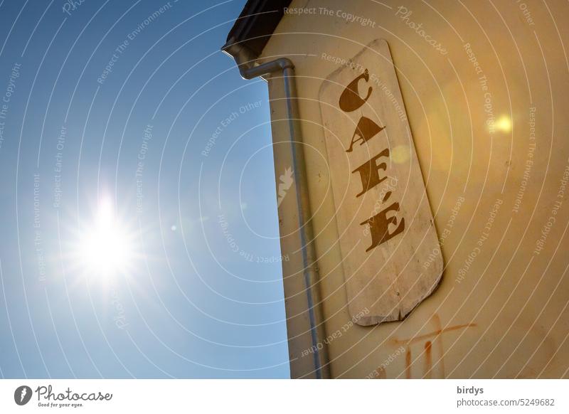 Sunlit cafe with blue sky Café sign sneeze Back-light Warmth Gastronomy House (Residential Structure) time-out Summer sunshine location Blue sky Sunbeam