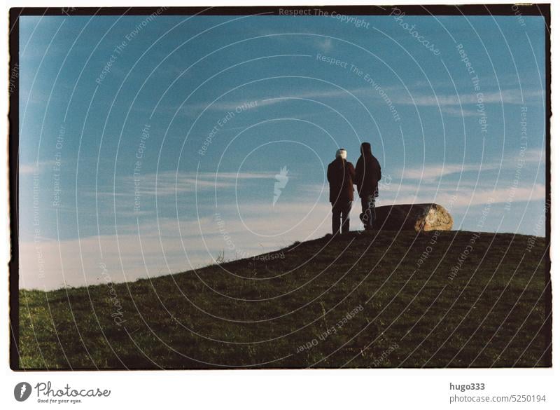 Two people on hill Man Woman Couple Friendship Adults Love Together togetherness Sky Hill Grass Far-off places look Outdoors wander far and wide Future Analog