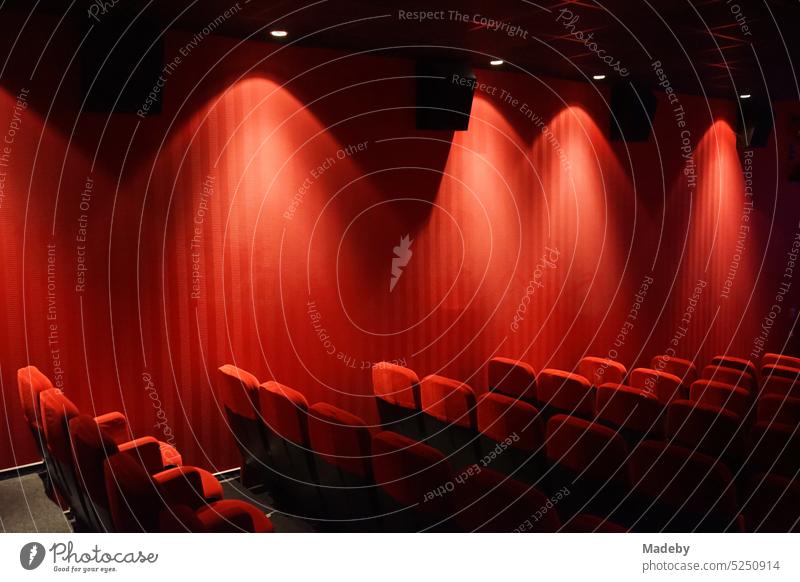 Velvet and plush in bright red in a traditional cinema hall of a cinema in Ravensburger Park in Bielefeld on the Hermannsweg in the Teutoburg Forest in East Westphalia-Lippe