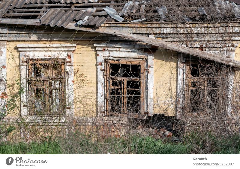 empty windows of a damaged house in Ukraine Donetsk Kherson Kyiv Lugansk Mariupol Russia Zaporozhye abandon abandoned attack bakhmut blown up bombardment broken