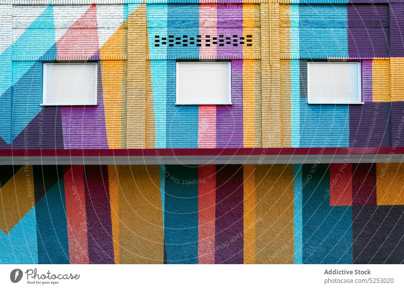 Exterior of bright colorful building wall geometry ornament window shutter exterior facade modern architecture urban design contemporary construction street