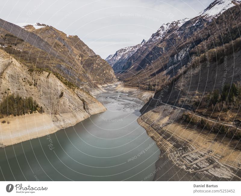 Panoramic drone shot of low water on Lac Chambon in French Alps active alpes alps alps mountains alps summer background barrage beautiful blue sky chambon